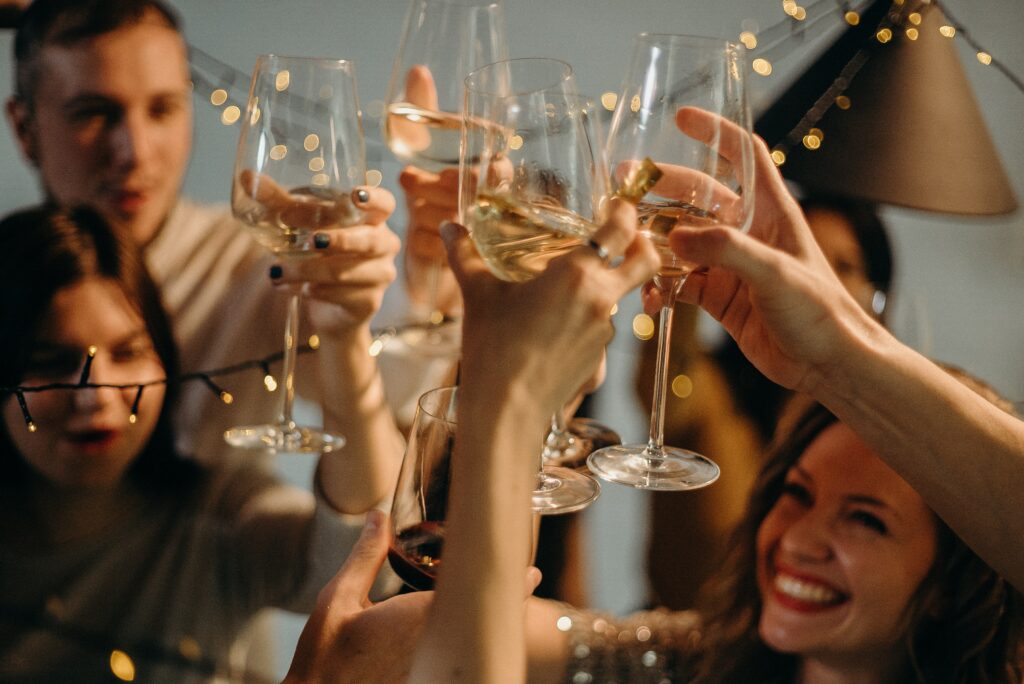 people drinking cheering wine