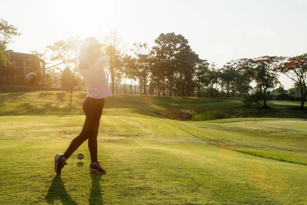 woman golfing in sun